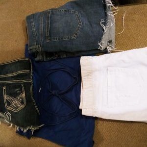 3 pairs of blue jean shorts and a tank top